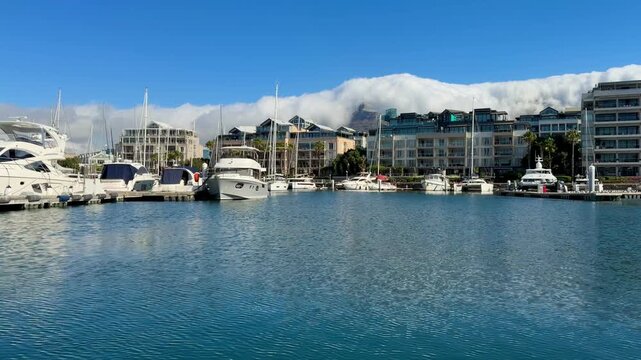 Cape Town, South Africa - January 31, 2026: Hop-on hop-off water boat tour at Cape Town&rsquo;s VA Waterfront, sunny weather, blue sky, relaxed holiday atmosphere with tourists enjoying harbor views. 