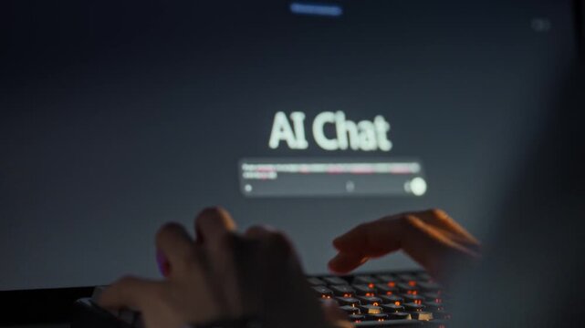The man's hands swiftly enter a query into a computer chat interface, engaging with an AI conversational model for information retrieval, exemplifying human-machine communication on a digital platform