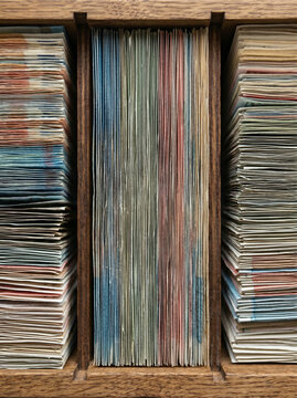 Bundles of various banknotes organized in a vertical rack