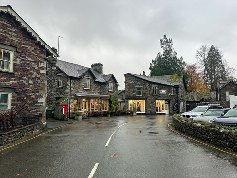 Grasmere, Cumbria, England, UK - 03.11.25. Grasmere village street view in Cumbria, Lake District. Rainy autumnal day in Lake District, beautiful colors of fall. Charming stone houses along the road. 