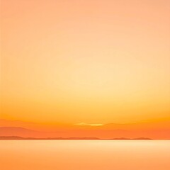 Obraz premium Vibrant Orange Sunset Over Calm Ocean and Distant Hazy Mountains Warm Sky