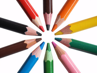 Fototapeta premium Colorful pencils arranged in a circle on white background