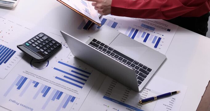 Team of business analysis documents in action office setting report generation professional environment strategic planning