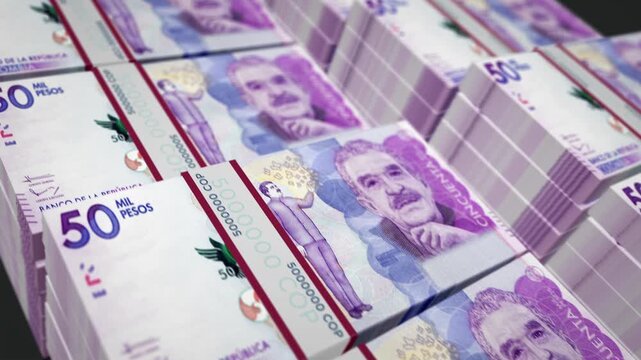 Stacks of fifty thousand Colombian pesos banknotes arranged in neat rows representing wealth, finance, and banking economy