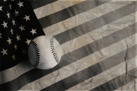 Old vintage baseball sport americana concept for holiday background with ball on old texture of American flag for Fourth of July holiday concept with copy space.