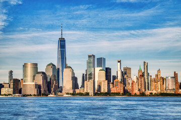 Fototapeta premium Illuminated New York City Skyline View at Sunset, New York