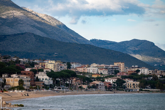 Green gardens with palm and citrus trees on seaside shore between Gaeta and Formia, Lazio, Italy