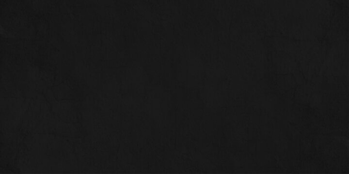 Solid black charcoal paper texture background with subtle grainy organic noise for elegant minimalist design projects. minimalist dark charcoal background featuring a fine, uniform grain.