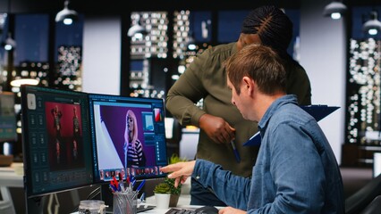Two graphic editors using AI and software for color retouching, creating professional content for creative industry. Diverse photographers editing photos and materials, text to image. Camera B. © DC Studio