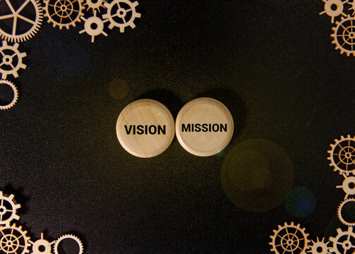 Vision and Mission words written over wooden cubes.
