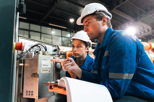 Repair and maintenance of machinery by specialist in industry factory following standards using spare parts for efficient operation
