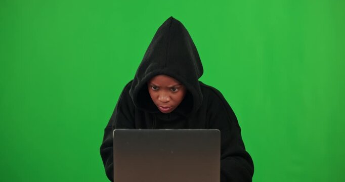 Black woman, green screen or hacker typing on laptop in cybersecurity, information technology or phishing. Hacking fraud, digital criminal or girl with big data intel, internet crime or code software