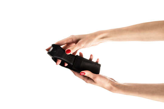 Black electric shocker with a flashlight on a white background