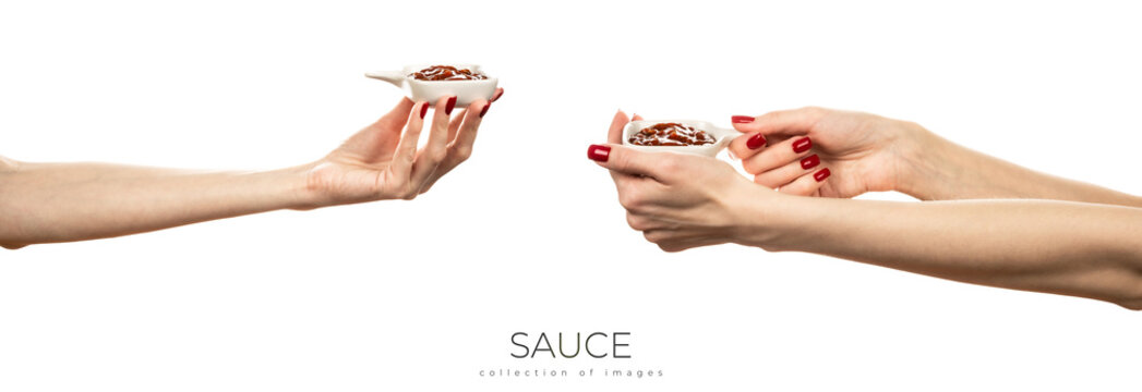 Bowl with red sauce isolated on white background