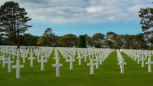 Rows of white crosses at the American World War II cemetery on the Normandy coast, Colleville-sur-Mer, Manche department, France, October 16, 2025. High quality 4k footage. 