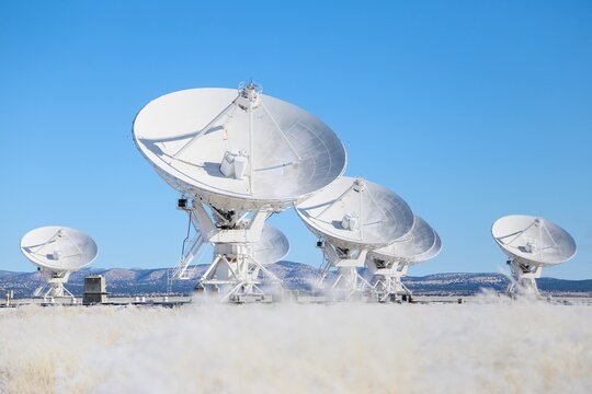 Giant Radio Telescope Antennas of the Very Large Array (VLA) Under Clear Blue Sky