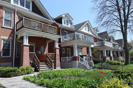 Street of large brick houses, oftem subdivided into apartments