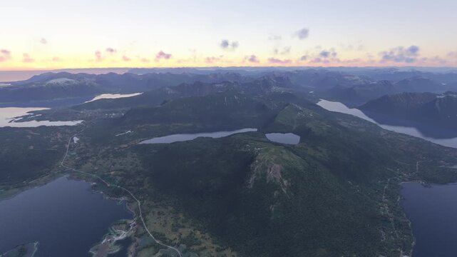Circular aerial drone shot at sunset of Vesteralen in Sortland. Norway
