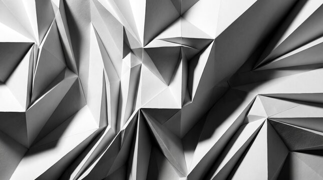 Abstract geometric paper folds in monochrome with shadow play