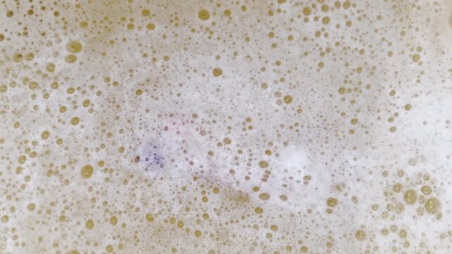 Swirling soapy bubbles create graphic background element
