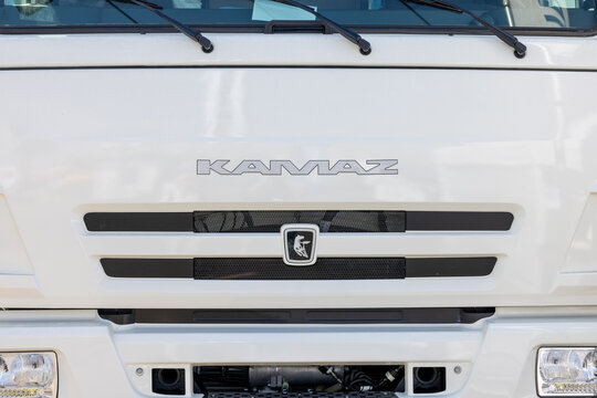 Front view of white KAMAZ truck cabin with brand name and logo on radiator grille. Exterior of modern commercial vehicle. Moscow, Russia - May 30, 2024