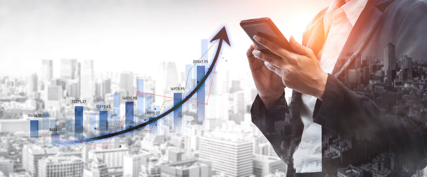 Businessman holding smartphone with a rising graph over a cityscape, illustrating growth and success in finance, technology, and modern business strategies. Scalp
