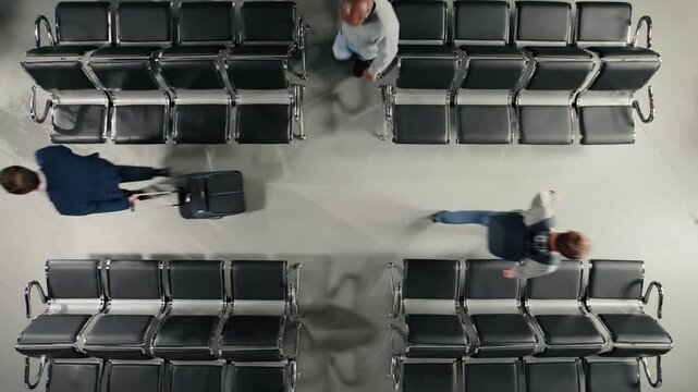 Walking, top down view and travelers in busy airport departure terminal. Preparing to fly home, high angle shot and people navigating through metal benches rows during holiday rush