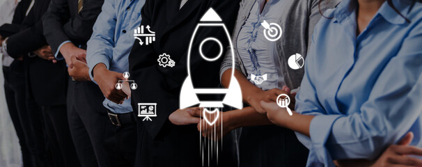 A group of business professionals stands united, symbolizing innovation and growth with a rocket icon, emphasizing teamwork, strategy, and future success. Trope © InfiniteFlow