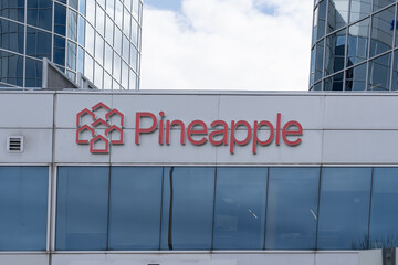 Naklejka premium Toronto, Ontario, Canada - May 3, 2026: Pineapple headquarters on Gordon Baker Road, North York, Ontario, Canada. Pineapple Financial Inc. is a Canadian mortgage technology and brokerage company. 
