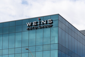 Naklejka premium Markham, Ontario, Canada - May 3, 2026: WEINS Auto Group headquarters on Victoria Park Ave in Markham, Ontario, Canada. WEINS Auto Group is an Automotive Group in Canada. 