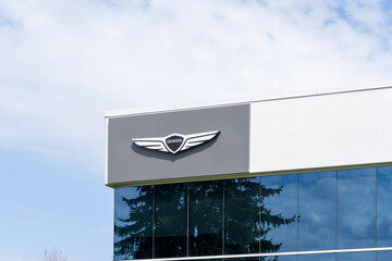 Obraz premium Toronto, Canada - May 3, 2026: A Genesis logo on the building. Toronto, Canada. Genesis is the luxury vehicle brand of the South Korean multinational conglomerate Hyundai Motor Group. 