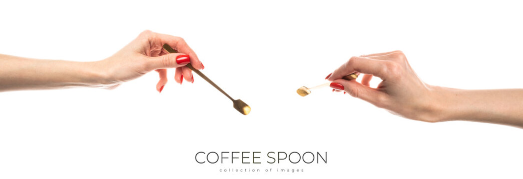 Coffee spoon in hand on white background