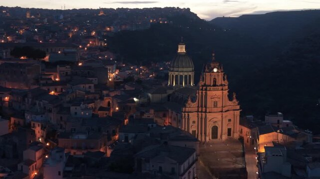 evening flying counter clockwise view of historic Ragusa Sicily