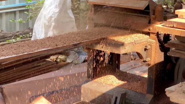 Rust metal sawdust woodworking machine factory industrial cutting plank board lumber workshop equipment processing material debris dust orange wood