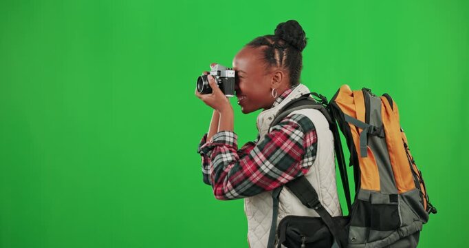 Photographer, green screen or happy black woman tourist walking in studio with mockup space taking pictures. Travel memory, photography or African girl hiking with a camera on an adventure journey