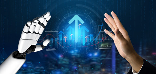 A human hand reaches toward a robot hand amidst a backdrop of digital growth indicators and data...