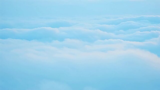 Beautiful tranquil landscape above the clouds, showcasing a horizon of light blue and white formations extending infinitely