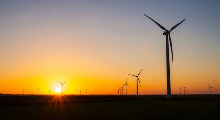 Obraz premium Wind turbines at sunset a sustainable energy landscape