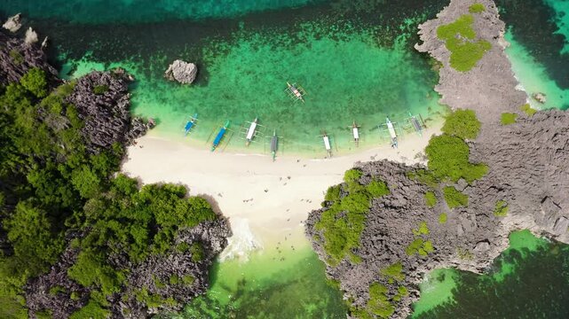 Travel concept: tropical sand beach and turquoise water view from the top. Lahos Island, Caramoan Islands, Philippines. Summer and travel vacation concept.