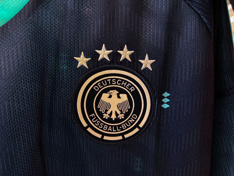 Calgary, Alberta, Canada. May 4, 2026. Gold Germany national football team crest and four stars embroidered on a dark textured jersey.