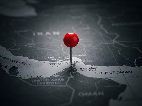 Close up of red pin on Strait of Hormuz map between Iran and Oman for geopolitics energy crisis