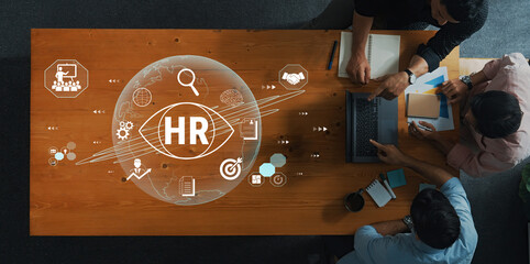 Collaborative Human Resources Development and Analysis Meeting with Digital Interface Elements...
