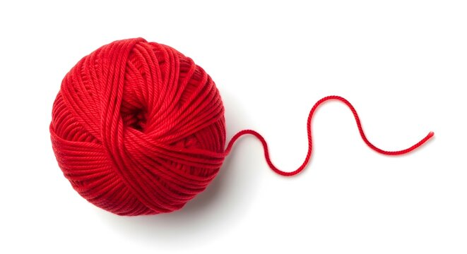 Red yarn ball with loose thread on white background