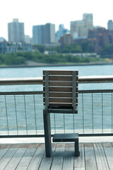 Fototapeta premium Tranquil Lakeside Perch Capturing Urban Horizon In Soft Pastel Evening Light new york