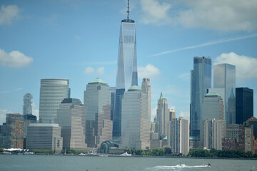 Fototapeta premium Cityscape With Serene Waters. Scenic Urban Landscape Featuring Calm River And Towering Buildings
