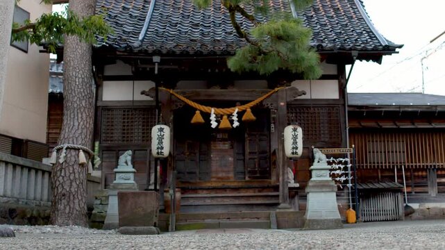 Traditional Shinto Shrine with Shimenawa Rope and Pine Tree in Kanazawa