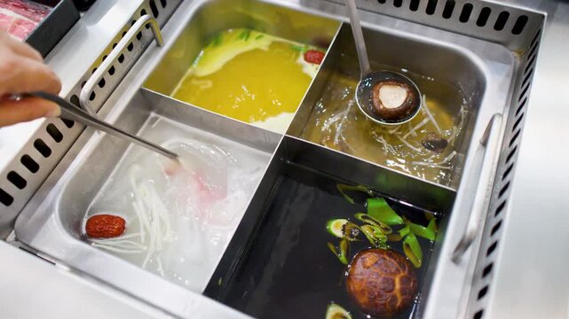 Thinly Sliced Beef Cooking in Boiling Chinese Hot Pot Broth