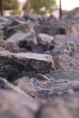 Fototapeta premium Close-up of Rugged Dark Granite Stones in Natural Sunlight