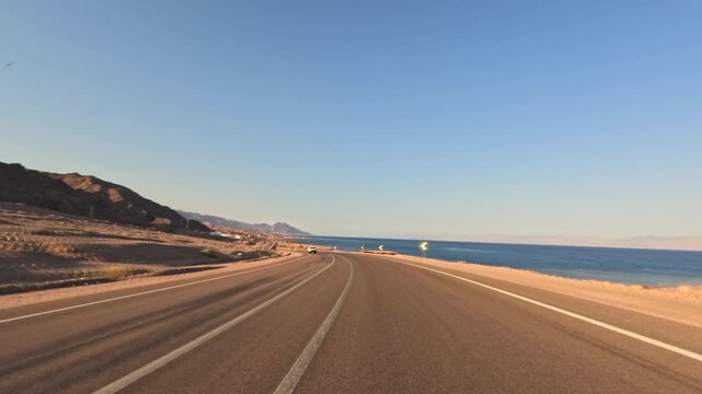 Time lapse of driving on empty coastal highway in the desert