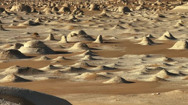 Many chalk rock formations creating surreal Sahara landscape in White Desert